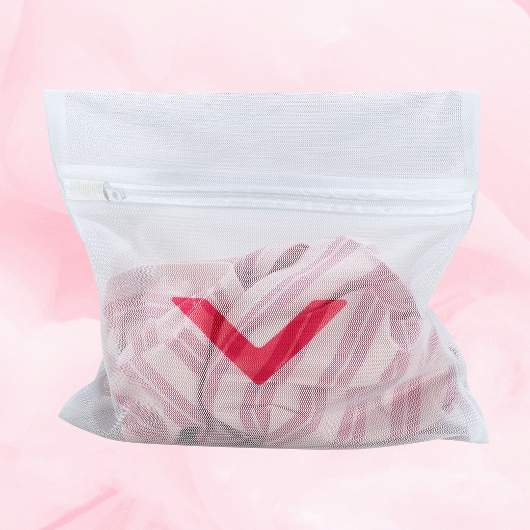 White mesh Laundry bag with red check mark, designed to protect period underwear in washing machine. Features zipper closure, allowing water flow while minimizing fabric damage.