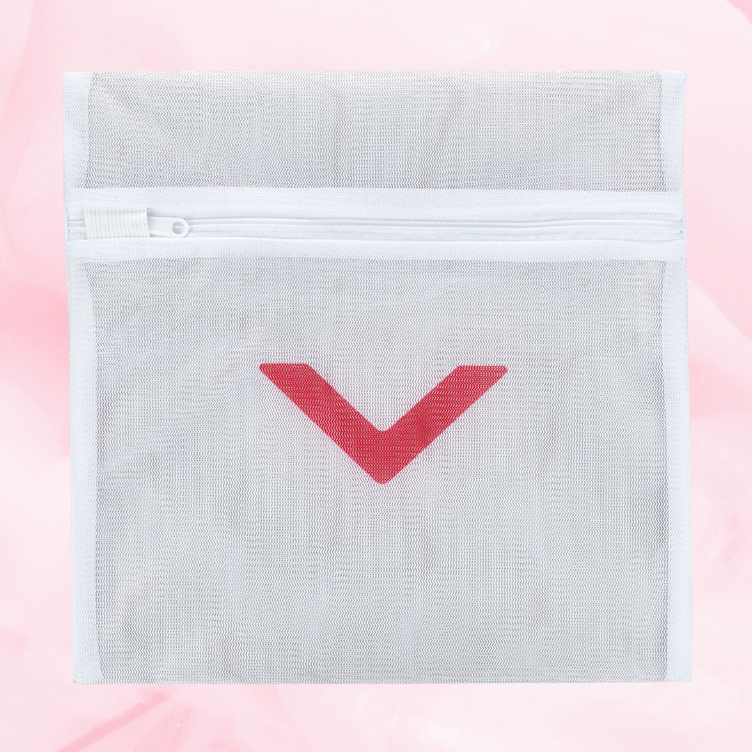Laundry bag with a red arrow design, crafted from protective mesh material, featuring a secure zipper for washing delicate period underwear safely.