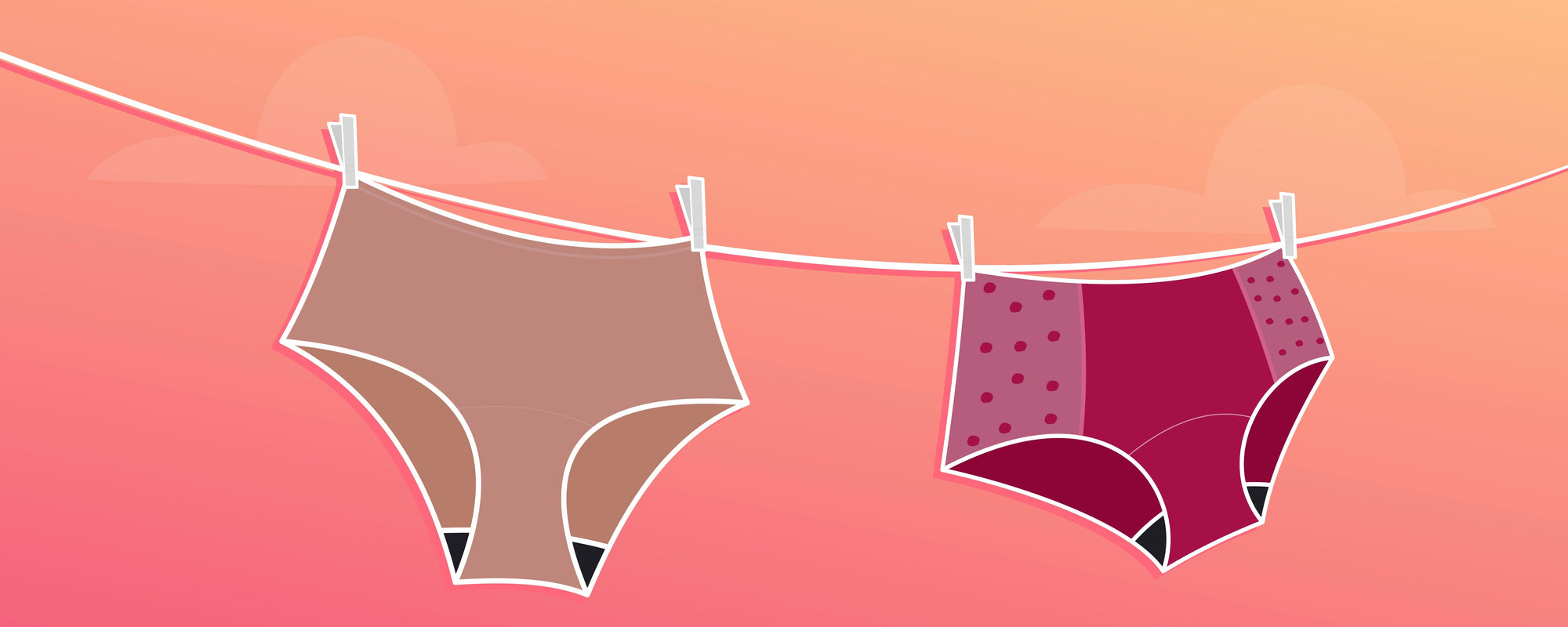 Two pairs of period pants hung to dry on a clothesline.