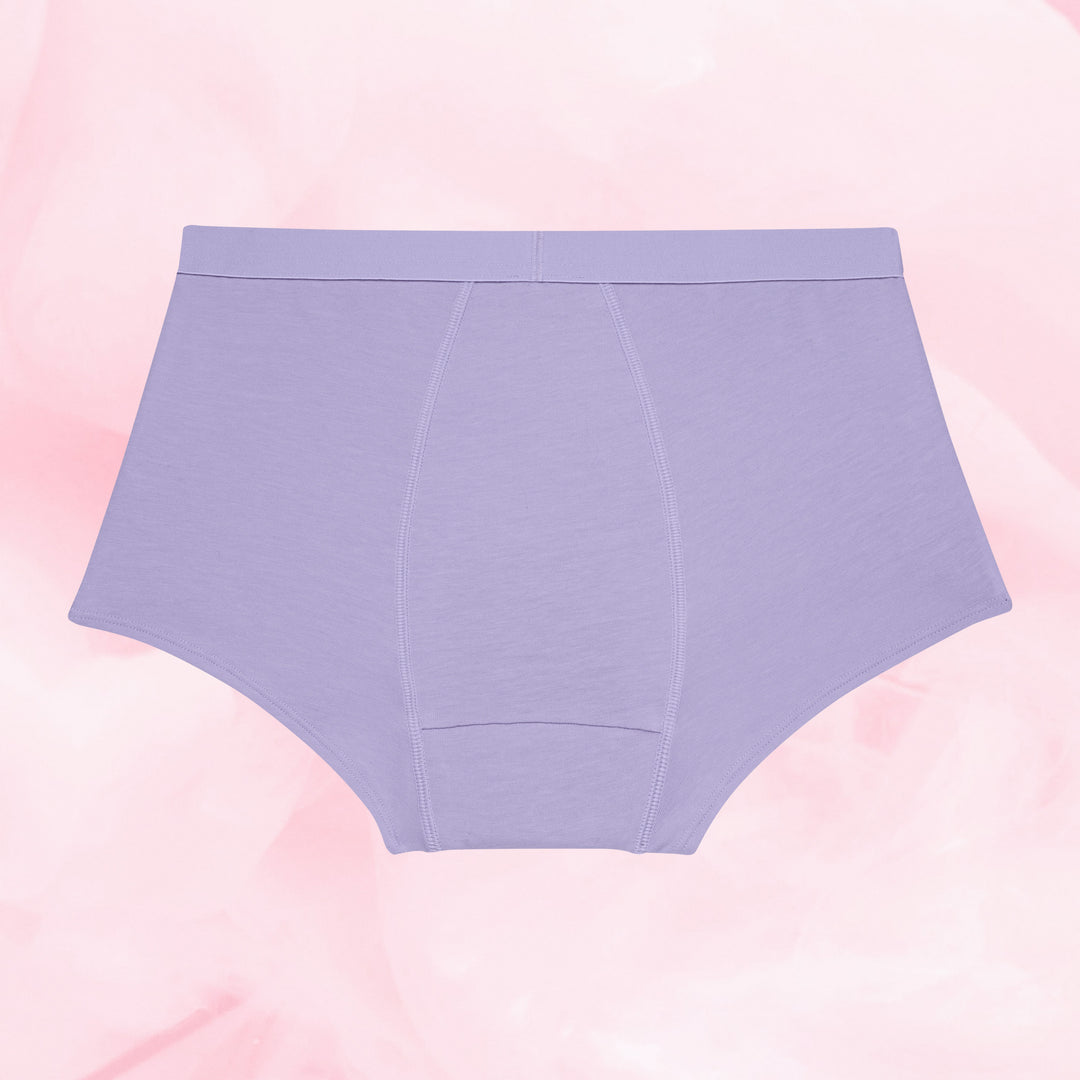 Teens Boxer Moderate high-waisted lavender briefs on marbled backdrop.