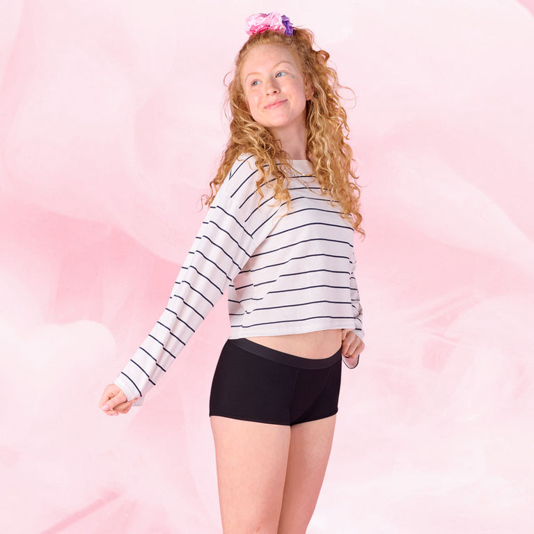 Teens Boxer Moderate worn by woman with relaxed expression.