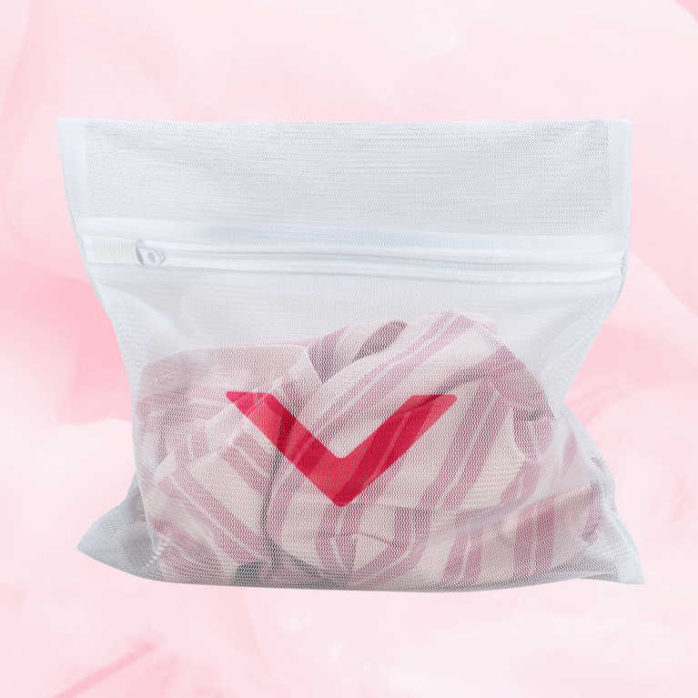 White mesh Laundry bag with red check mark, designed to protect period underwear in washing machine. Features zipper closure, allowing water flow while minimizing fabric damage.