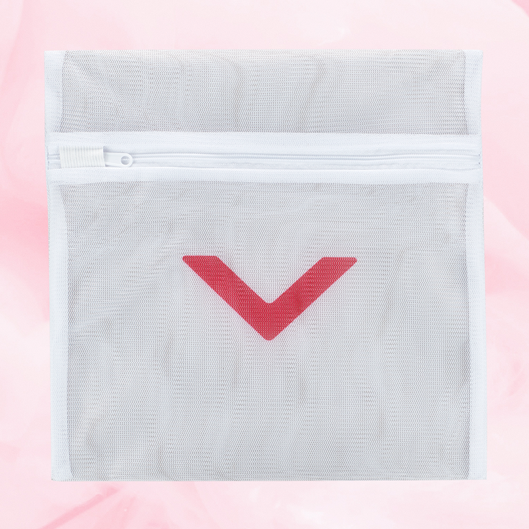 Laundry bag with a red arrow design, crafted from protective mesh material, featuring a secure zipper for washing delicate period underwear safely.