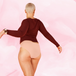ComfortFit Essentials Brazilian Light showcases a woman wearing red shirt and beige period pants, highlighting their sleek Brazilian cut and discreet fit for confident protection.