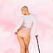 Woman modeling ComfortFit Essentials Hipster Logo Waistband Moderate period pants, showcasing a confident stance with a cane, emphasizing fit and functionality.